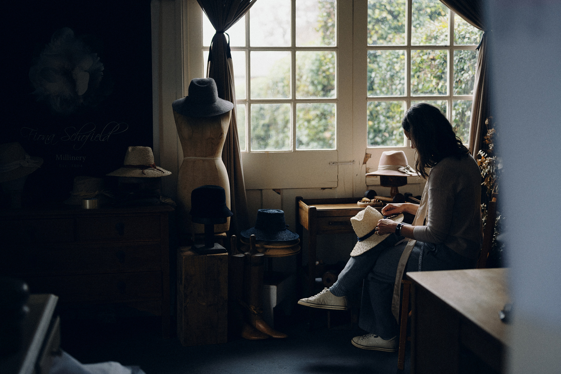 Milliner working at her bench in her Sydney hat studio – personal branding photography by MelCreative
